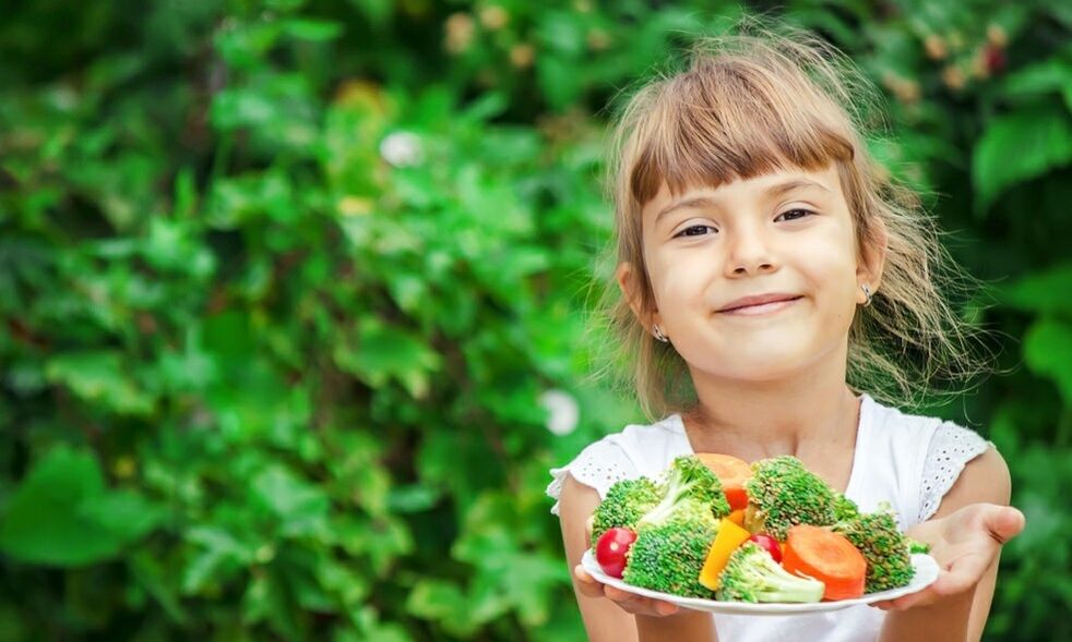 Girl with vegetable plate